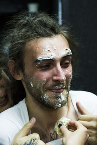 Man with icing on face