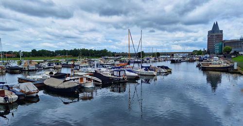 Boats moored at harbor