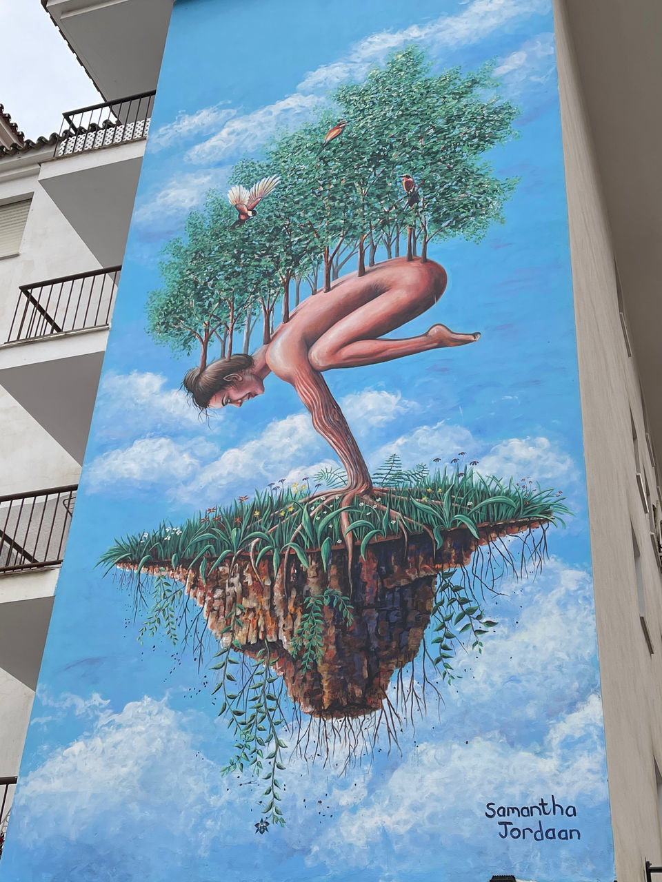 art, nature, poster, sky, plant, tree, mural, day, advertising, architecture, one person, blue, swimming pool, outdoors, water, cloud, low angle view, built structure, adult, building exterior, holiday