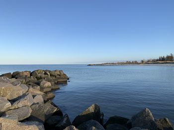 Scenic view of sea against clear blue sky