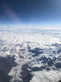 Aerial view of landscape against sky during winter