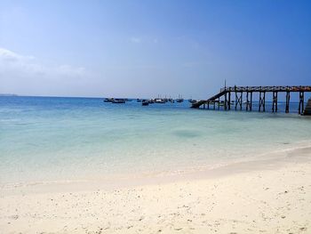 View of beach against blue sky