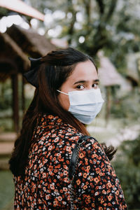 Portrait of woman standing outdoors