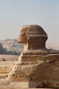 Side view of sphinx against clear sky