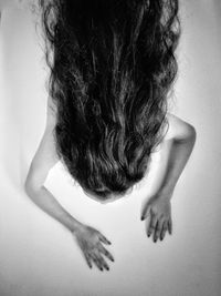 High angle view of woman with long hair lying on floor