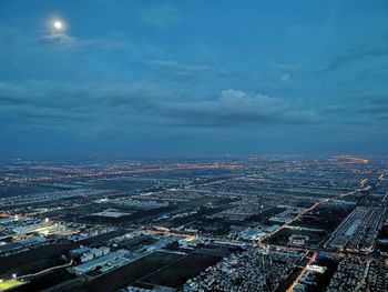 High angle view of illuminated buildings in city against sky