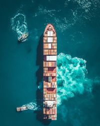 Aerial view of container ship sailing on sea 