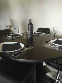 High angle view of empty chairs and tables in kitchen