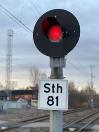 Close-up of road sign on railroad track