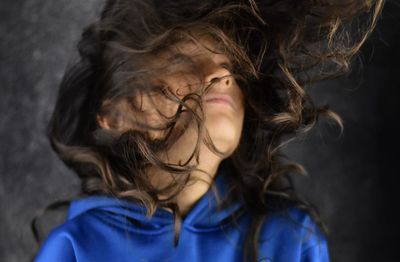 Close-up of girl with tousled hair