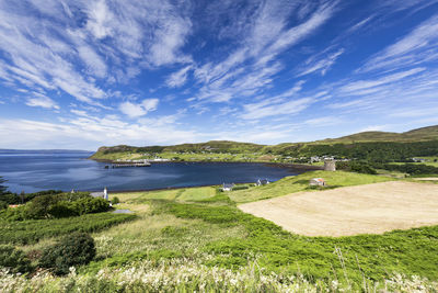 Scenic view of sea against blue sky