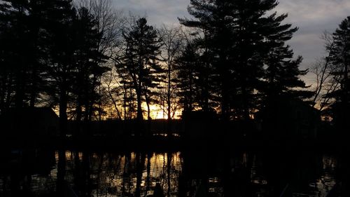 Scenic view of river at sunset