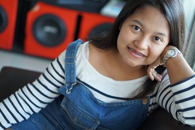 Portrait of smiling woman at home