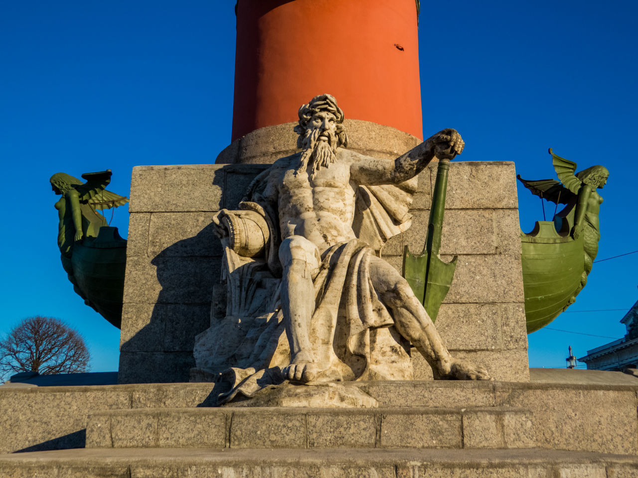 LOW ANGLE VIEW OF FEMALE STATUE AGAINST CLEAR BLUE SKY