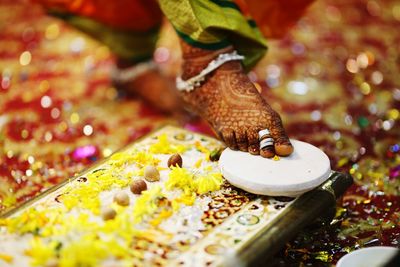 Low section of woman on floor during wedding ceremony