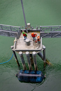 High angle view of workers at oil refinery