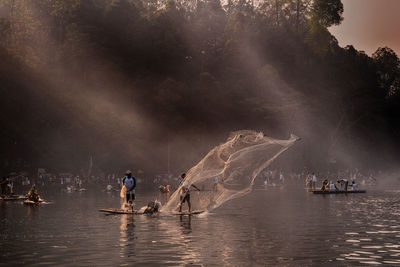 People fishing in sea