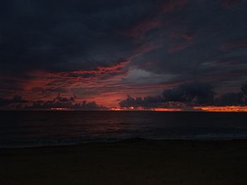 Scenic view of dramatic sky over sea during sunset