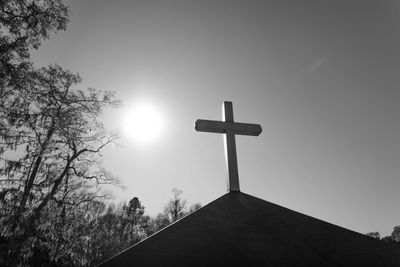 Low angle view of cross against clear sky