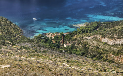 High angle view of trees and sea against sky