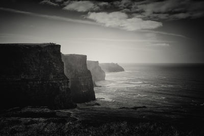 Scenic view of sea against cloudy sky