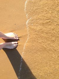 Shadow of people on beach