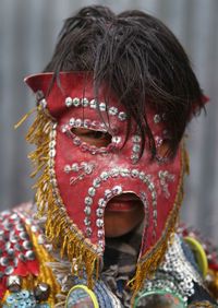 Close-up of man wearing mask during festival