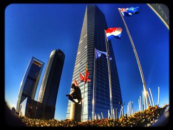 Low angle view of buildings against blue sky