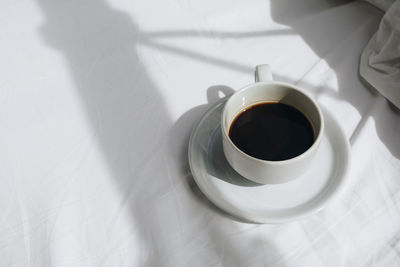 High angle view of coffee cup on table