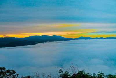 Scenic view of mountains against sky during sunset