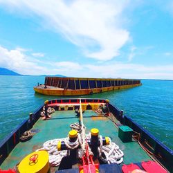 Boats in sea against sky