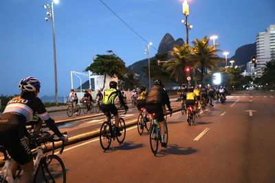 People riding bicycle on road