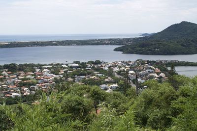 High angle view of townscape by sea