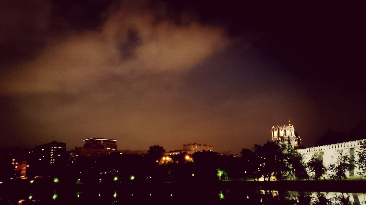 architecture, building exterior, built structure, night, sky, illuminated, city, tree, residential building, silhouette, dusk, building, residential structure, house, outdoors, dark, cityscape, low angle view, no people, cloud - sky