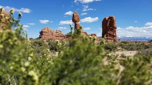 Rock formations on landscape against sky