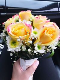 Close-up of hand holding bouquet