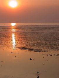 Scenic view of sea against sky at sunset
