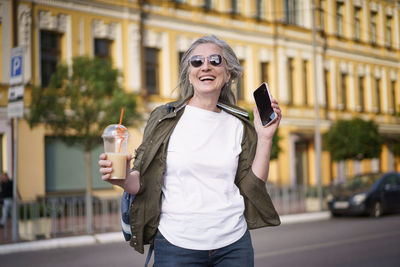 A mature european woman enjoys life walking in the city. biohacking concept. 