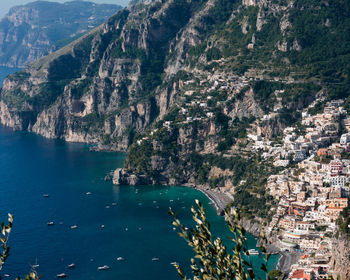 High angle view of sea and city