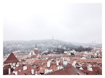 Cityscape against sky during winter