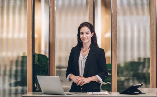 Smile receptionist welcome at hotel front desk