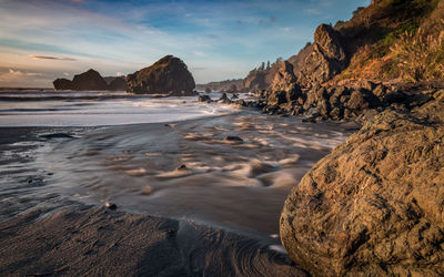 Scenic view of coastline against sky