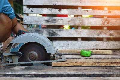 Low section of man sitting on bench