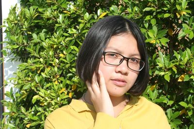 Portrait of teenage girl standing outdoors