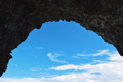Low angle view of rock formation against sky
