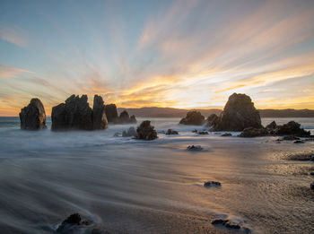 Scenic view of sea against sky during sunset