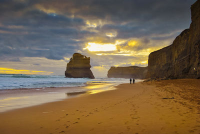 Scenic view of beach against sky during sunset