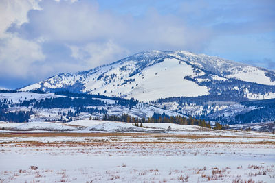 Scenic view of snowcapped mountains against sky