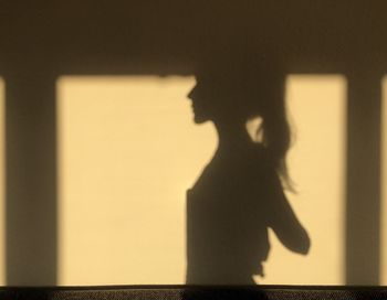 Shadow of woman on wall