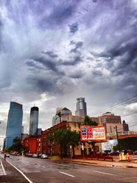 City buildings against cloudy sky